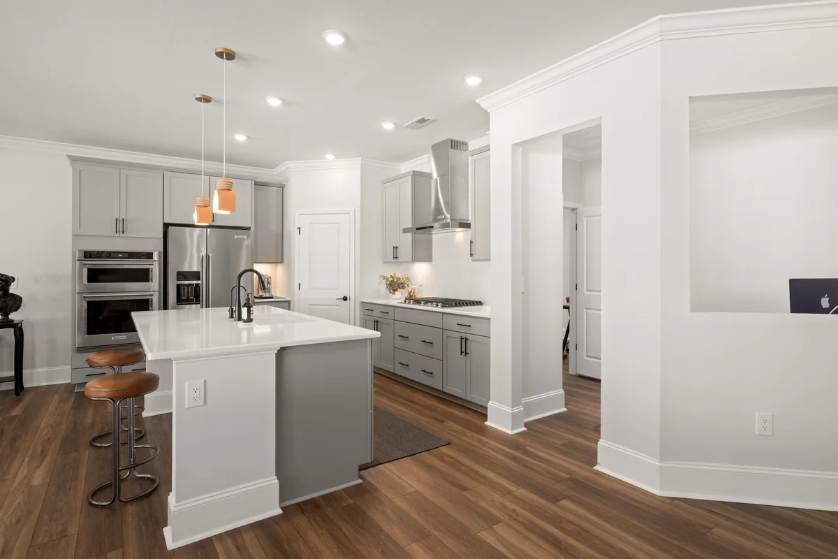 Modern modular kitchen with island by Zyra Modulars